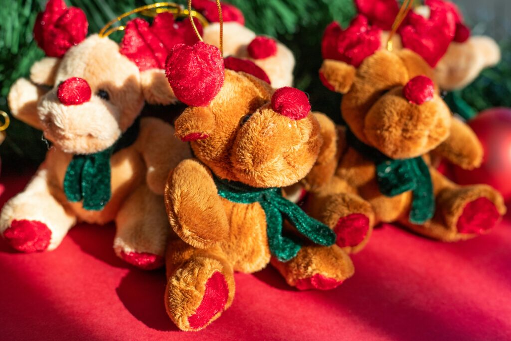 Christmas-themed reindeer stuffed toys with red and green accents in a festive holiday setting — perfect cool toys.